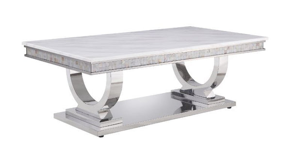 This beautiful contemporary work places a strong emphasis on lustrous materials that make a bold statement of personality and style. Shiny metal frame and white marble top complement each other perfectly, making the table more visually appealing. The Zand