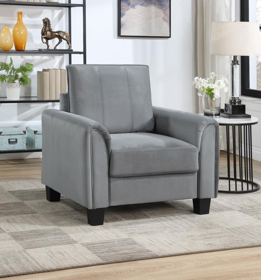 Vertical stitching and rounded arms create a compelling profile for a modern upholstered accent armchair. Perfect for lounging, it boasts velvety soft gray upholstery that-'s on-trend and versatile in your den or living room. A plush seat cushion sits on 