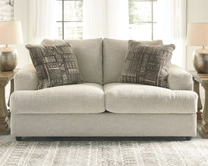  this loveseat puts the contemporary in your contemporary home. Its â€œthree over twoâ€ profile eliminates the center seat cushion