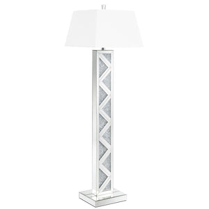 Bring bold glamour to your interior with this contemporary floor lamp, featuring a mirrored base adorned with sparkling crystal-like accents in a striking geometric pattern. A crisp white fabric shade adds contrast and diffuses soft ambient light. Perfect