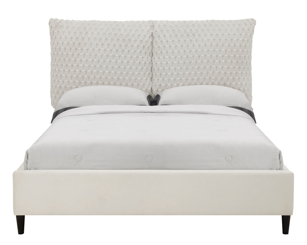 This luxurious bed is the centerpiece of a serene and sophisticated bedroom oasis. It features an opulent, tufted headboard that rises high to make a grand statement, upholstered in a sumptuous fabric that invites a touch of elegance and comfort. The bed-
