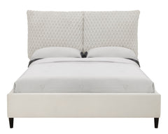 This luxurious bed is the centerpiece of a serene and sophisticated bedroom oasis. It features an opulent, tufted headboard that rises high to make a grand statement, upholstered in a sumptuous fabric that invites a touch of elegance and comfort. The bed-