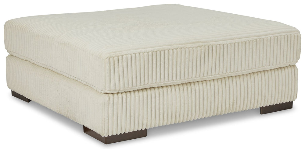 Plush and posh. Showcase your eye for on-trend texture with the statement-making cord upholstery of this oversized accent ottoman. Its stunningly soft fabric entices in an ivory hue, complementing contemporary color palettes. Let your feet sink into the s
