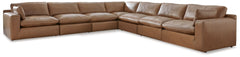 Catering to your contemporary lifestyle, this sectional is a handsome marriage of masculine and feminine sensibilities. Feather-fiber cushions and bolster pillows soften the look of its chunky, linear silhouette. A warmly hued combination of leather and f