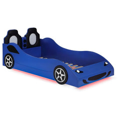 Modern race car aesthetics inform the design of a novelty car bed perfect for kids. Its twin size is versatile, allowing for plenty of space to play within the bedroom. The car is complete with realistic details and features LED strip lighting underneath,