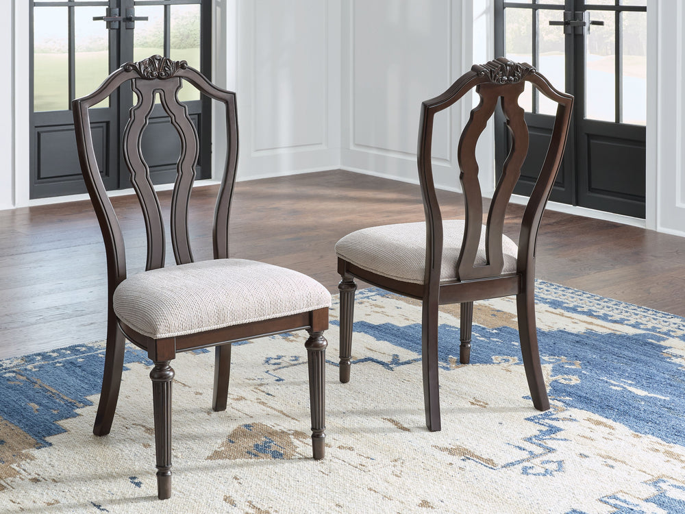 Serve up elegance and poise with this dining chair. Its traditional silhouette is detailed with a stylized back for added opulence. The cushioned seat, crisply tailored in textured tan fabric, provides added comfort. From breakfast to dinner, this chair e