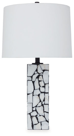 This exquisite table lamp is artfully adorned, with a mosaic pattern of white marble playing beautifully against a black background. Complemented by a modified drum shade for a sophisticated sensibility, the lamp casts an elegant glow in the entryway or l