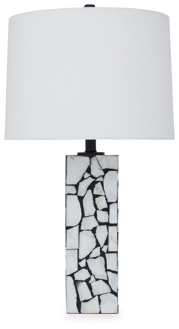 This exquisite table lamp is artfully adorned, with a mosaic pattern of white marble playing beautifully against a black background. Complemented by a modified drum shade for a sophisticated sensibility, the lamp casts an elegant glow in the entryway or l