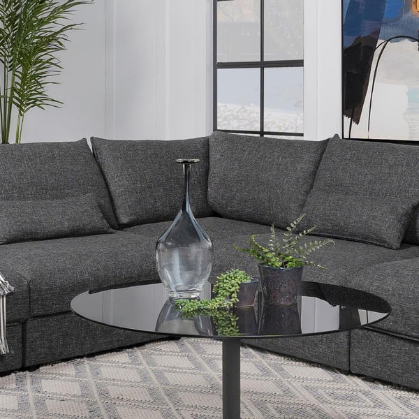  designed to create a seamless transition between seating pieces. Upholstered in barely black fabric