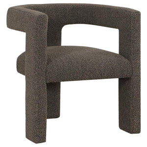 Enveloped entirely in the embrace of plush bouclÃ©, this chair redefines the art of relaxation with its all-fabric design. The seamless transition from the cushioned seat to the curved arms, all robed in the same soft fabric, creates a cocoon of comfort. 