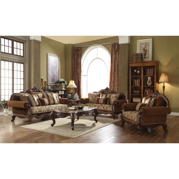 With Classic elements of rolled carved and grooved camel back leading to the center top carving, the Jardena sofa is a piece of art as well as a comfortable addition to any living room. It features an arched tight back with loose cushions, and inviting po