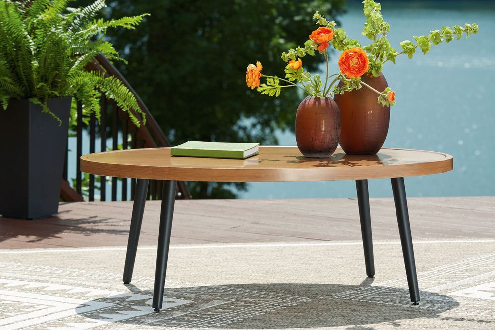 This outdoor coffee table recalls the aesthetics of nature to bring an inviting, high-style feel to your patio or lanai. Made of aluminum with a wood look tabletop, it combines beauty and longevity. Worried about the weather? Donâ€™t sweat itâ€”the durabl
