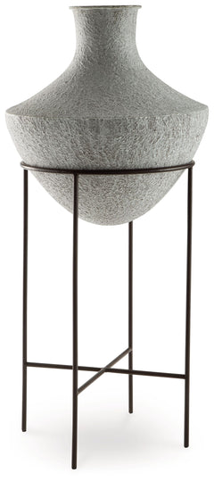 Take an effortlessly inviting approach to floor decor. This vase-'s distressed, textured look in a neutral hue pairs with a variety of casual color palettes. An espresso brown stand adds charming contrast to the look. And this vase enthusiastically welcom