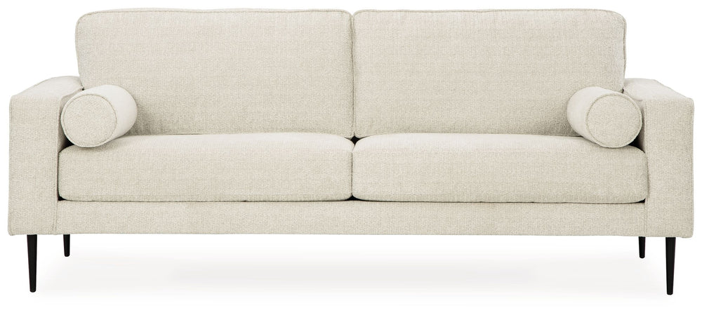 Simple comfort meets modern function in this sofa. An apt addition to apartments and other small spaces, the slim-profiled piece welcomes you with its cozy character. A subtle chevron pattern on the cushions refresh the classic neutral hue, elevating the 
