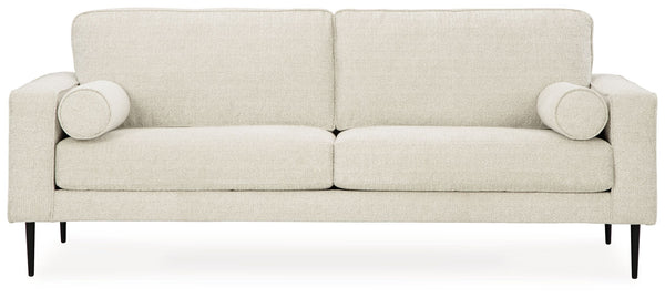 Simple comfort meets modern function in this sofa. An apt addition to apartments and other small spaces, the slim-profiled piece welcomes you with its cozy character. A subtle chevron pattern on the cushions refresh the classic neutral hue, elevating the 