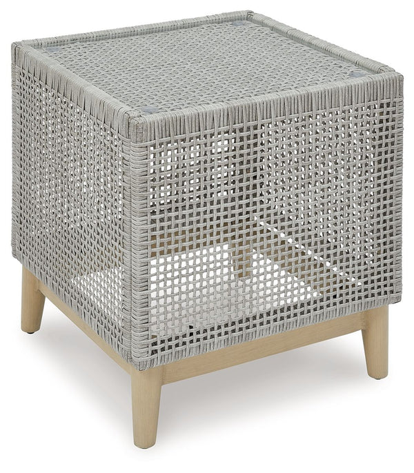 This end table invites your casual contemporary style outdoors. With its resin wicker in a chic neutral hue, it expertly marries refined design with durability. Breezy summer mornings and cold winter nights are made all the more enjoyable with a glass tab