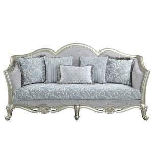  this Qunsia sofa makes a gracious statement in a comforting light gray linen upholstery fabric. Delicate curves invite the eye