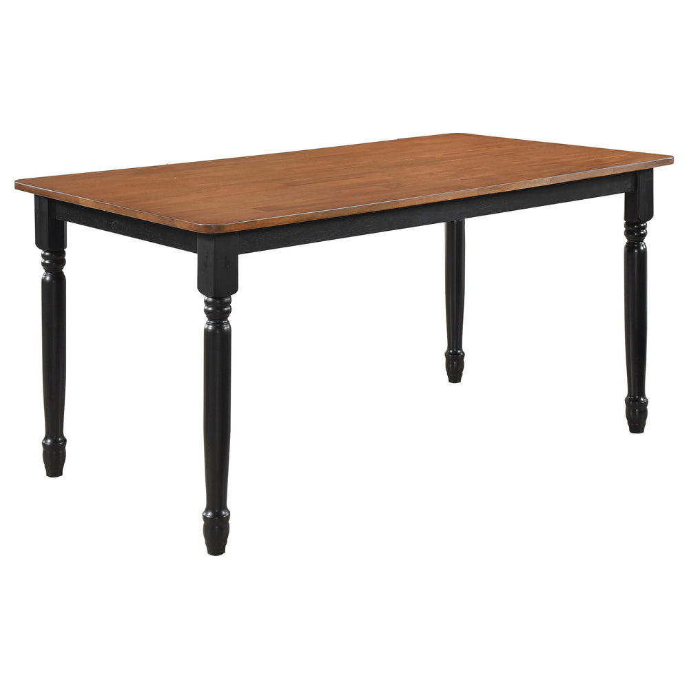 Enjoy gatherings for meals and conversation at this traditional dining table. A charming addition for a welcoming space, it features a compact rectangular profile perfect for four or six, with a distinctive two-tone look that catches the eye. The table fe
