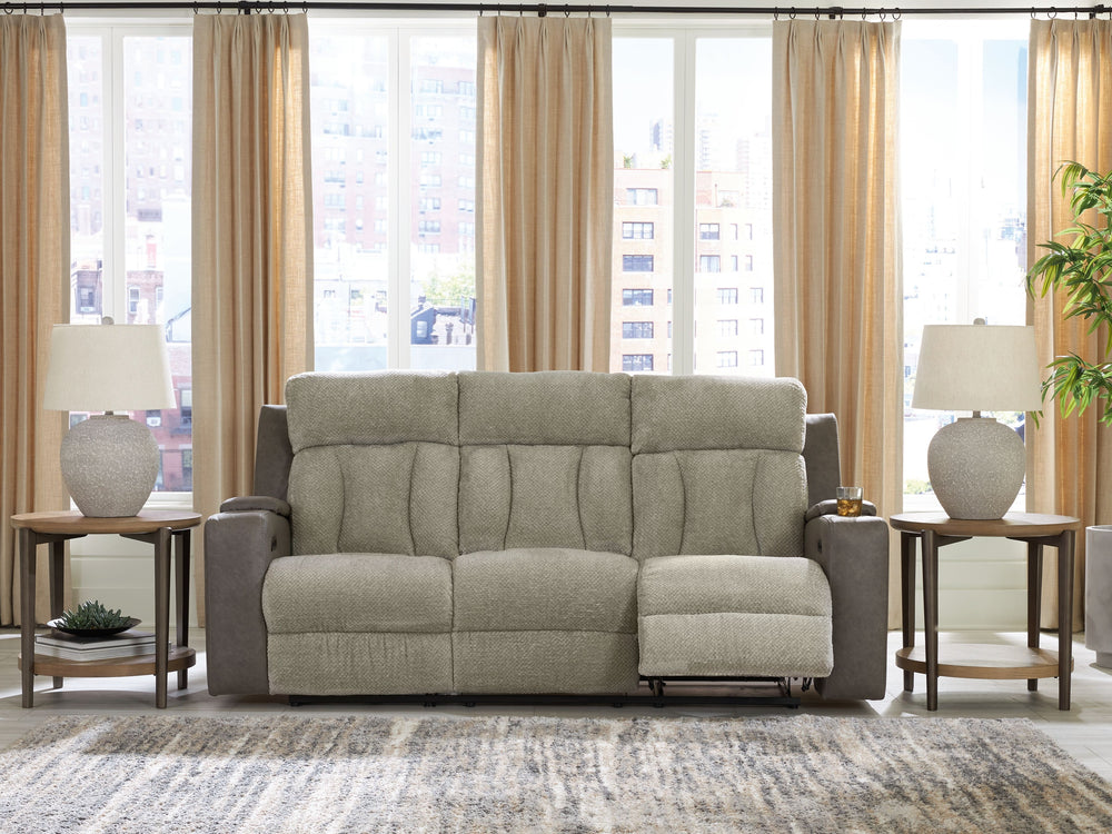 Refined relaxation, reimagined for the modern home. This power reclining sofa combines premium comfort with smart features like built-in storage arms, wireless charging and a drop-down table. One-touch reclining and adjustable headrests let you find your 