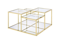 Modern simplicity makes your space feel uncluttered and stylish. The Uchenna Coffee Table has a brilliant color and lustrous finish to enhance it-'s sleek modern silhouette. Metal table frame in a gold finish exudes lustrous shine, topped with tempered gl