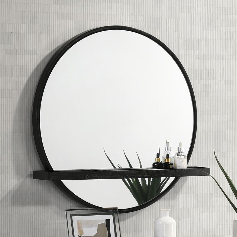 Add a chic vanity mirror over a vanity desk or your dresser to create the ideal place to get ready for the day. The mirror features a round profile with a wooden frame and straight, horizontal shelf. Its black finish is perfect to complement the wood grai
