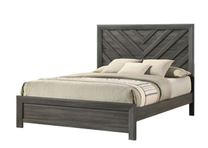  a bed with a distinguished chevron patterned headboard