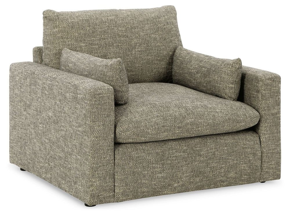 On the days when rest and relaxation seem out of reach, this oversized chair provides a positively plush seating experience. Its feather-fiber blend cushions invite you to float away in cloud-like comfort. Striking granite-hued upholstery and a streamline