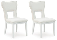 Embracing modern glamour, this dining chair is a dazzling addition to your dining area. A bright white lacquer finish and a contemporary cutout design give it a look all its own. The sumptuous upholstery wows with metallic thread accents.<br><br><b>Additi