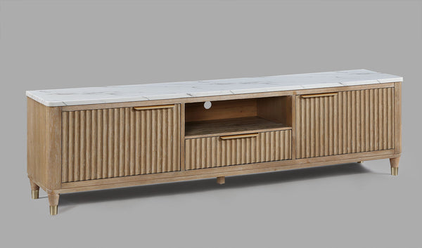 This entertainment console brings modern luxury and sleek sophistication to any living space. Featuring a fluted wood facade with a pristine white faux marble top, this piece embodies refined elegance. Brass-tone accents and tapered legs add a touch of mi