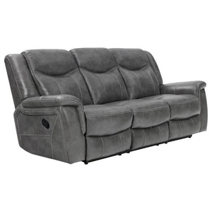 Grey is the trendy color these days and it doesn-'t look any better than on this opulent motion sofa. It features angled seat backs with extra padded headrests for ultimate luxury. Armrests and even the leg rest on the recliner are padded for extra comfor