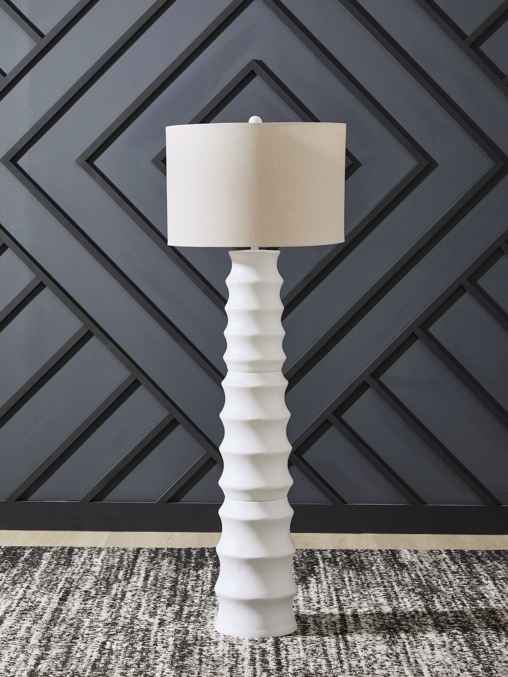 Add flair to your lair with this striking floor lamp. With a distinctive scalloped design and a fresh white finish, itâ€™s cool from every angle. And its versatile style looks right at home everywhere from contemporary places to casual spaces. The matchin