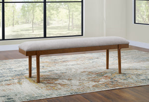  capturing the architectural language of mid-century stylings. Its seat invites the eye with a soft-edged silhouette and neutral gray cushion. A ca