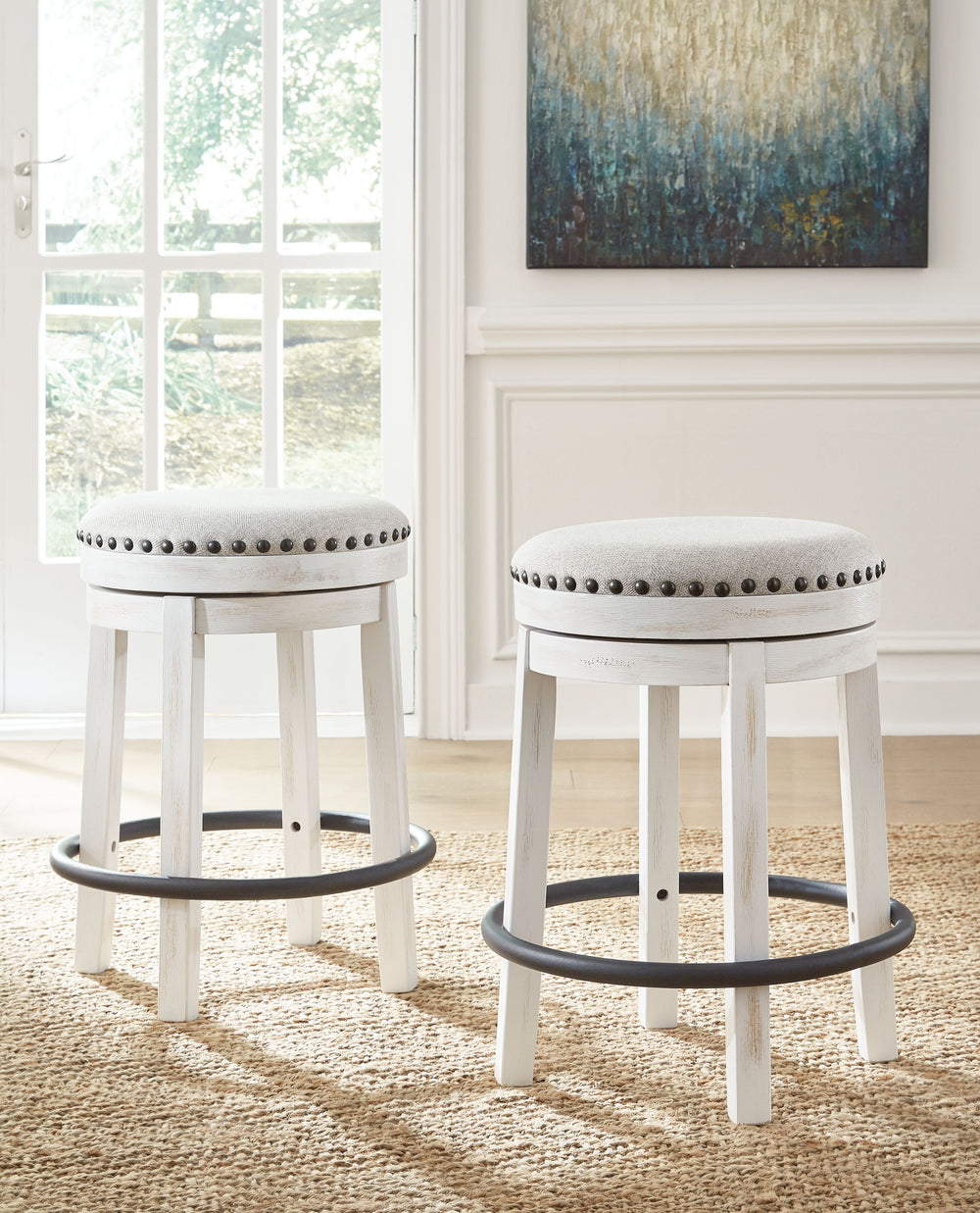 A touch of rustic-industrial style is such a fashion-forward choice, and this swivel stool doesnâ€™t disappoint. Its smooth swivel motion adds function, while nailhead trim brings effortless style. A softly upholstered cushion seat in beige keeps things c