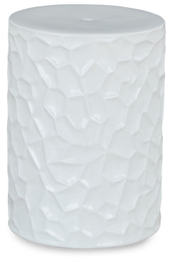 Inspired by modernist sculpture, this contemporary accent stool is an homage to the power of art. Ideal for any outdoor or indoor living space, it features bold irregular patterned sides and a minimalist matte white finish, creating an instant aura of for