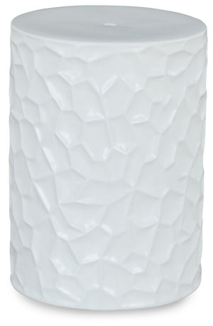 Inspired by modernist sculpture, this contemporary accent stool is an homage to the power of art. Ideal for any outdoor or indoor living space, it features bold irregular patterned sides and a minimalist matte white finish, creating an instant aura of for