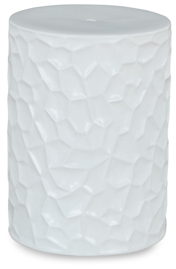 Inspired by modernist sculpture, this contemporary accent stool is an homage to the power of art. Ideal for any outdoor or indoor living space, it features bold irregular patterned sides and a minimalist matte white finish, creating an instant aura of for