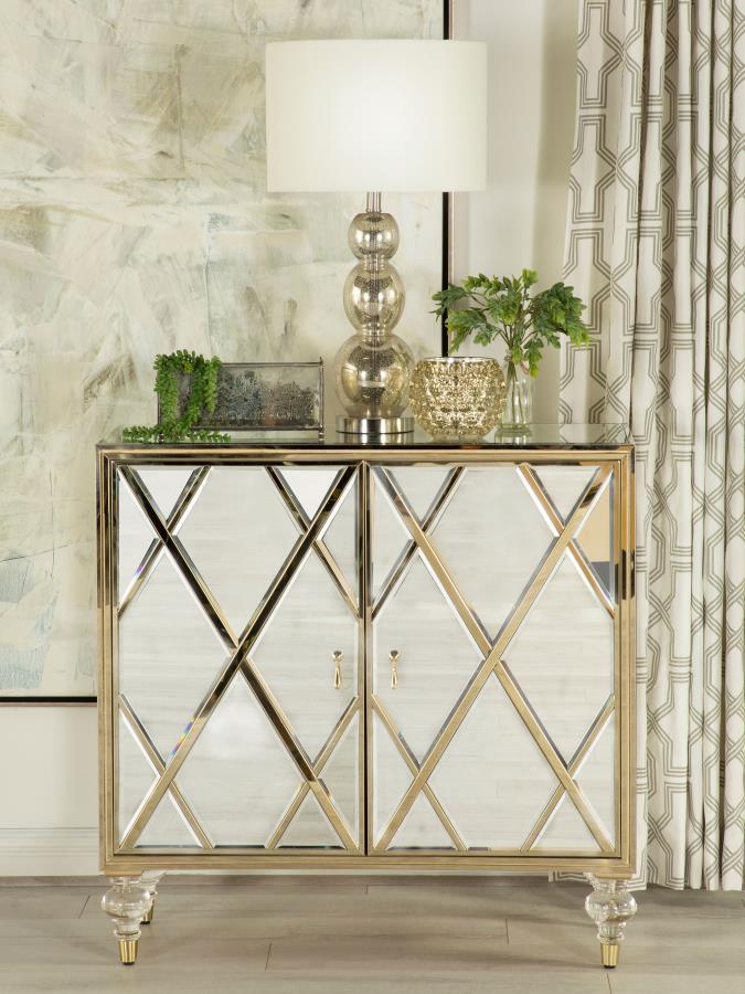 Polished materials and luxe accents combine to create this stunning, glam accent cabinet. Covered almost entirely in mirror surfaces, this accent cabinet boasts a latticed design in the dual cabinet doors, inset with a champagne diamond pattern. The shimm