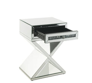  the accent table boasts a faux diamonds inlay that reflect a rainbow of colors throughout the room. T