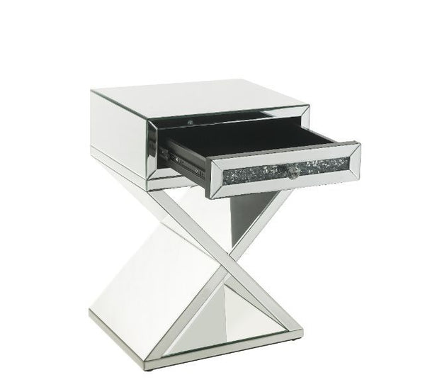  the accent table boasts a faux diamonds inlay that reflect a rainbow of colors throughout the room. T