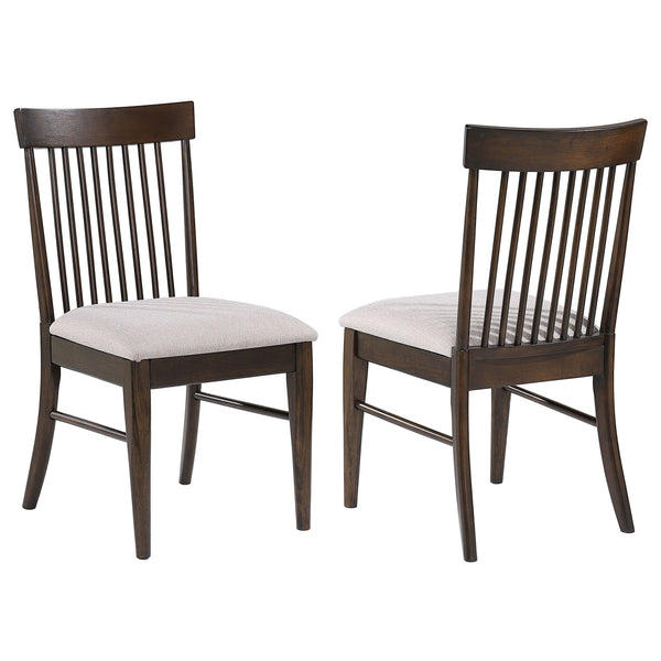 Neutral wheat upholstery sets a refined tone for a set of two mid-century dining side chairs. The armless chairs offer comfortable seating for your kitchen or dining room. Each features a foam padded seat that pairs perfectly with a classic spindle back. 