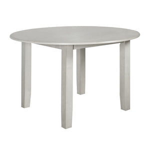 Discover the Pascal Wood Round Dining Table in Driftwood Gray, a refined and versatile addition to any dining area. Crafted from a durable combination of solid Rubberwood and manufactured woods, this table promises long-lasting stability and strength. Its
