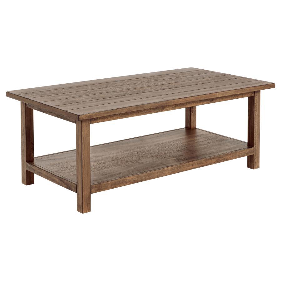 Bring timeless appeal and ample surface space to your living area with this rectangular coffee table. A pine wood and engineered wood construction, enhanced by pine veneer, ensures durability while exuding a warm rustic charm. Its open lower shelf keeps d