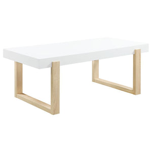 A spacious white high-gloss tabletop defines the modern appeal of this rectangular coffee table. The thick square-edged surface rests within a sled-style base supported by dual U-shaped legs. Crafted from engineered wood, its bright white hues contrast be
