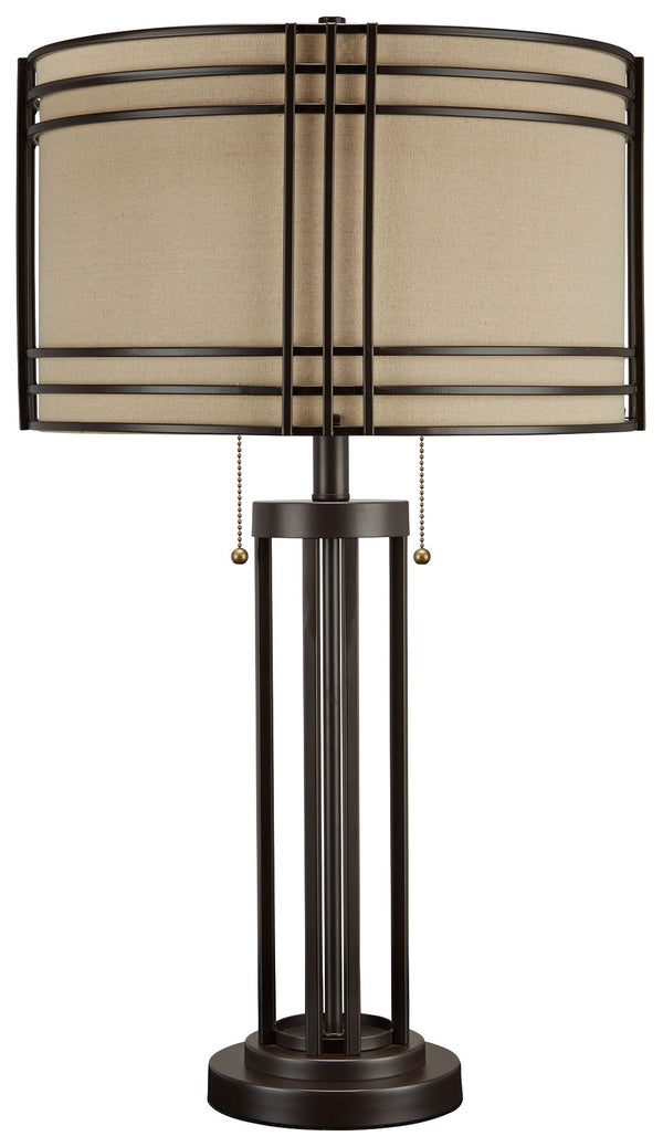 Add a touch of rustic industrial style to your decor with this eye-catching table lamp. Its drum shade and decorative metal frame bring an appealing touch to your home. A dark brown finish complements the shade-'s lighter neutral color, making this lamp i