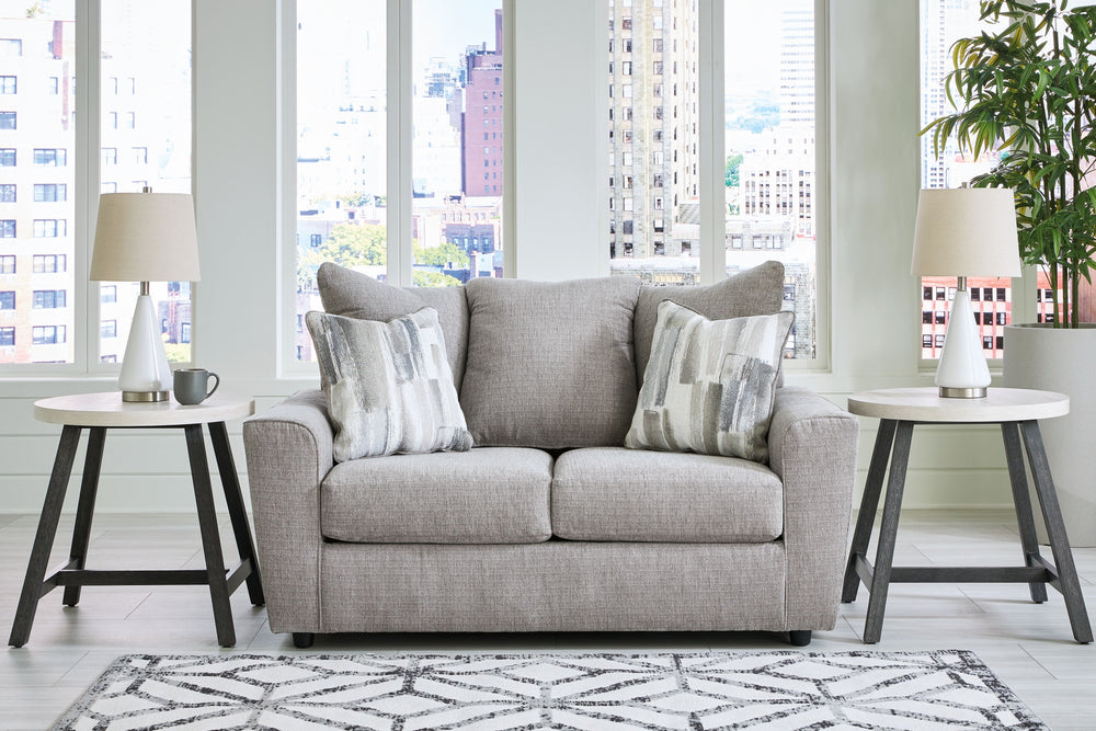 Whatâ€™s new in neutrals? Shades of gray, of course. Embrace the sophisticated design trend with this gorgeous loveseat, which offers a clean-lined, contemporary style at a comfortably cool price. Sure to lift your spirits, the plush chenille fabric is fa