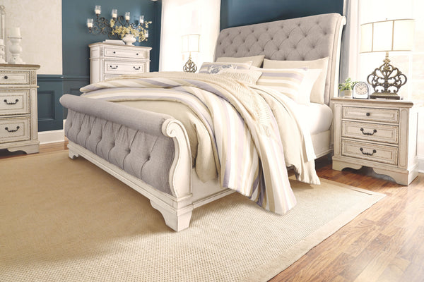  this California king upholstered sleigh bed is your dream bedroom retreat realized. A curvaceous beauty