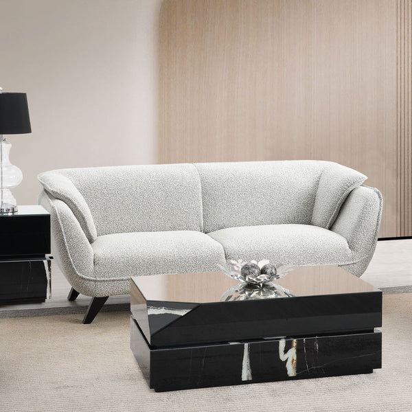 <p>Unwind in the sophisticated charm of the Nayeli sofa, draped in light gray fabric. Accompanied by plush seatting, it offers a perfect blend of comfort and style. This sofa invites cozy conversations and serene relaxation, making it an ideal addition to