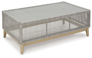 This coffee table invites your casual contemporary style outdoors. With its resin wicker in a chic neutral hue, it expertly marries refined design with durability. Breezy summer mornings and cold winter nights are made all the more enjoyable with a glass 