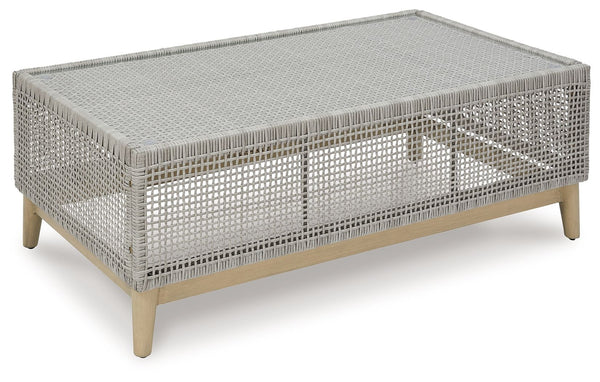 This coffee table invites your casual contemporary style outdoors. With its resin wicker in a chic neutral hue, it expertly marries refined design with durability. Breezy summer mornings and cold winter nights are made all the more enjoyable with a glass 