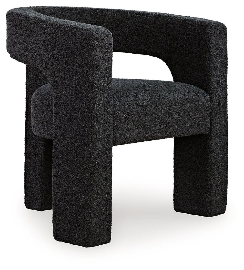 With its sculptural silhouette and barrel-back design, this accent chair exudes runway-inspired style. Peek-a-boo styling and decadent boucle upholstery combine both fashion and comfort seamlessly. Who says cutouts are just for your wardrobe?<br><br><b>Ad